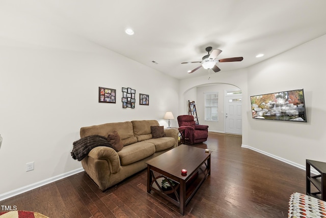 7235 Terregles Dr, Raleigh, NC 27617 - living room with arched walkways, wood finished floors, a ceiling fan, and recessed lighting