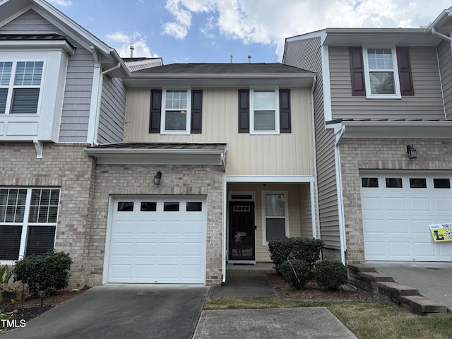 7235 Terregles Dr, Raleigh, NC 27617 - view of property featuring an attached garage and concrete driveway