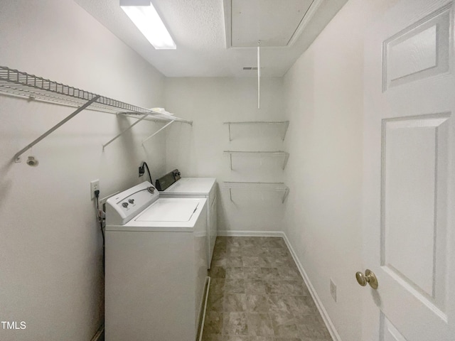 6701 Winding Arch Dr, Durham, NC 27713 - laundry room featuring attic access, washer and dryer, and a textured ceiling