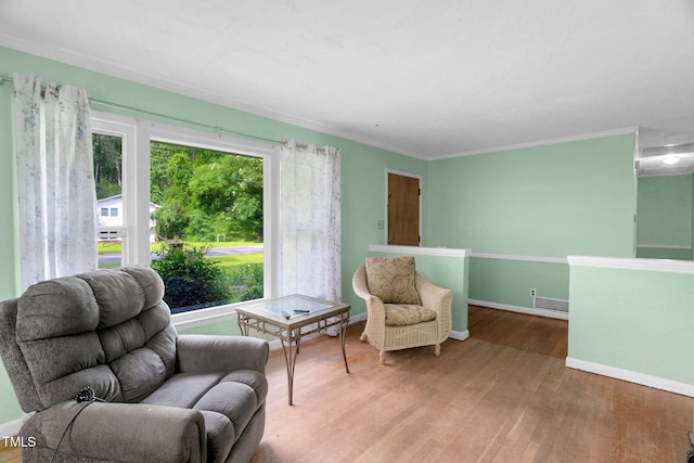 106 Lattimore Ln, Durham, NC 27713 - sitting room with wood finished floors and ornamental molding