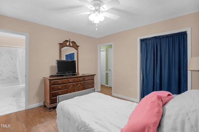 106 Lattimore Ln, Durham, NC 27713 - bedroom with light wood-style flooring, ensuite bath, and a ceiling fan
