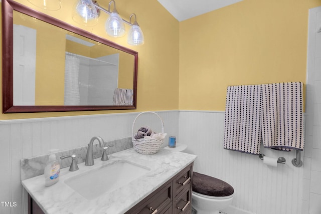 106 Lattimore Ln, Durham, NC 27713 - full bath with vanity, a wainscoted wall, and a shower with shower curtain
