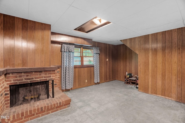 106 Lattimore Ln, Durham, NC 27713 - unfurnished living room with wooden walls and a fireplace