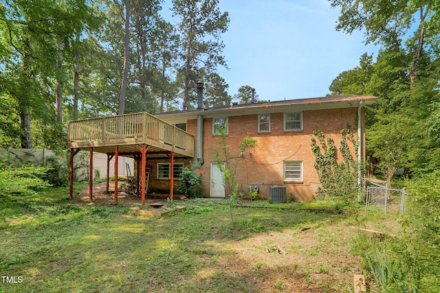 106 Lattimore Ln, Durham, NC 27713 - rear view of house featuring brick siding and a deck