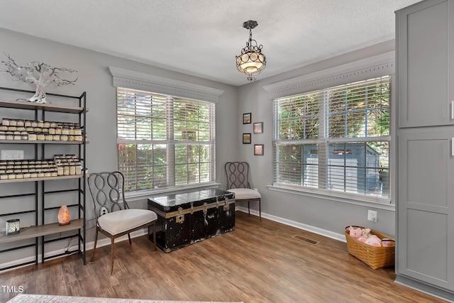 2302 Fordcrest Dr, Apex, NC 27502 - living area featuring wood finished floors and a textured ceiling