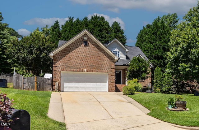 2302 Fordcrest Dr, Apex, NC 27502 - traditional home featuring brick siding, an attached garage, and driveway
