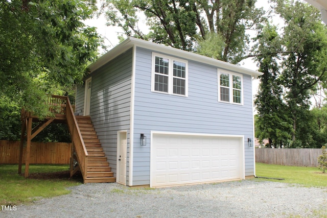 4511 Denfield St, Durham, NC 27704 - view of property exterior with stairs and a garage