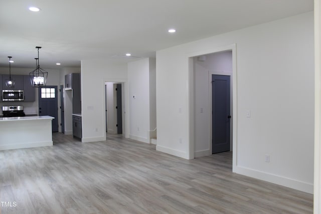 4511 Denfield St, Durham, NC 27704 - unfurnished living room featuring recessed lighting and light wood finished floors