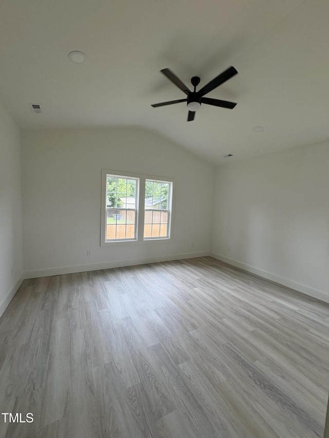 4511 Denfield St, Durham, NC 27704 - empty room featuring lofted ceiling, wood finished floors, and a ceiling fan