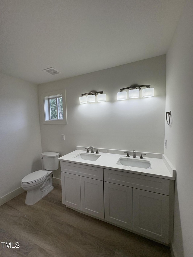 4511 Denfield St, Durham, NC 27704 - bathroom with wood finished floors and double vanity