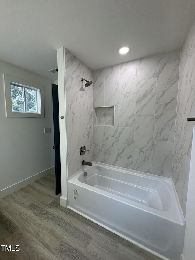 4511 Denfield St, Durham, NC 27704 - full bath with shower / bathtub combination, recessed lighting, and wood finished floors