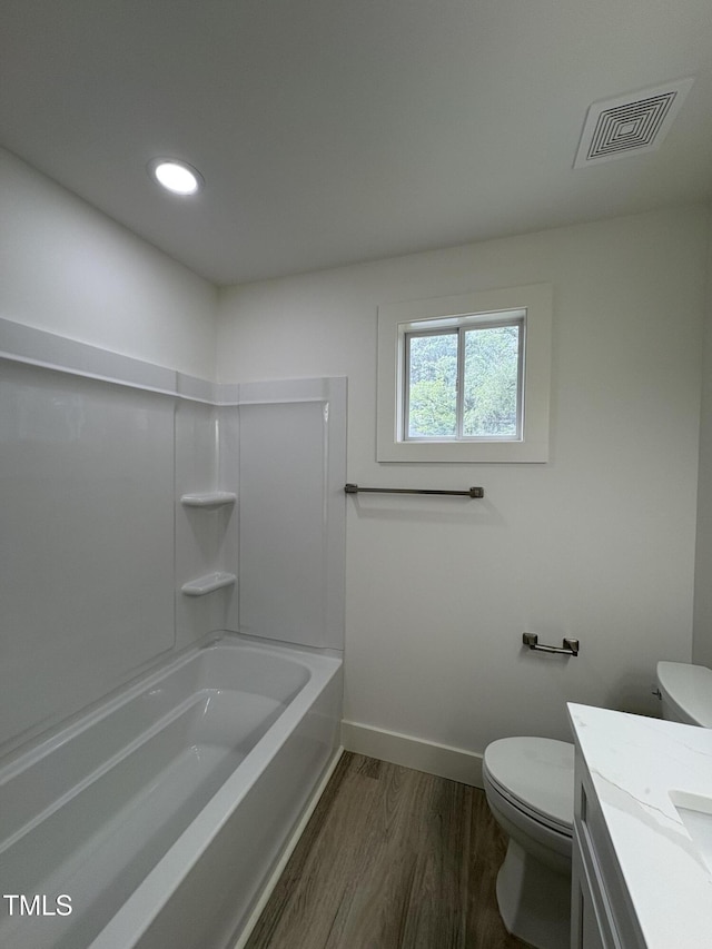 4511 Denfield St, Durham, NC 27704 - full bathroom featuring wood finished floors, vanity, bathing tub / shower combination, and recessed lighting