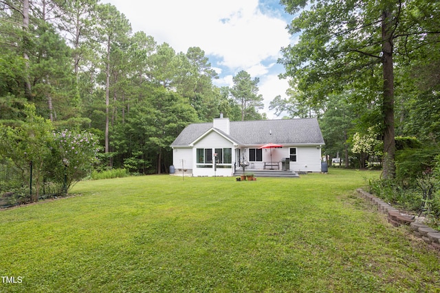 404 Denton St, Durham, NC 27713 - back of property featuring a chimney, a yard, and a wooden deck