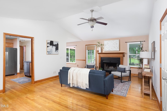 404 Denton St, Durham, NC 27713 - living area with lofted ceiling, light wood-style flooring, a ceiling fan, a fireplace, and plenty of natural light