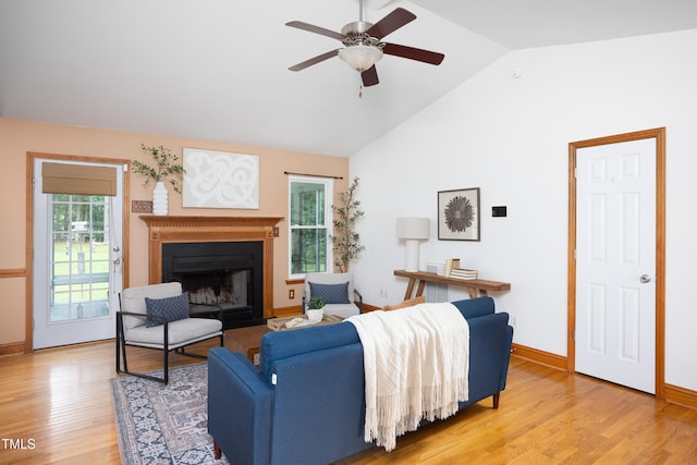 404 Denton St, Durham, NC 27713 - living room with a ceiling fan, light wood finished floors, a fireplace, and high vaulted ceiling