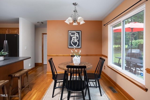404 Denton St, Durham, NC 27713 - dining area featuring a chandelier and light wood-style floors