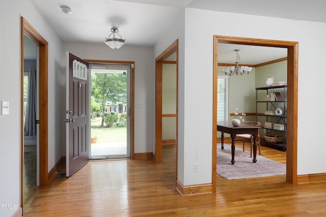 404 Denton St, Durham, NC 27713 - foyer with light wood-type flooring and a chandelier