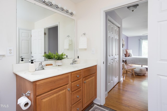 404 Denton St, Durham, NC 27713 - ensuite bathroom with double vanity and wood finished floors