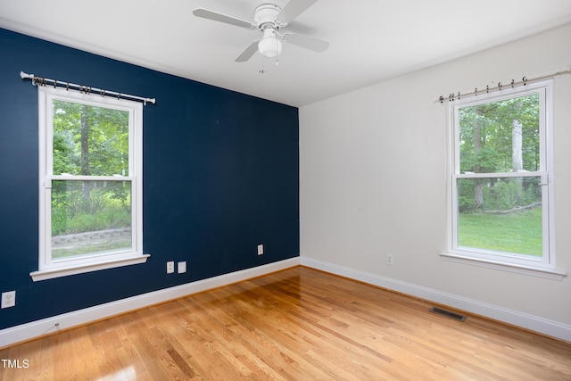 404 Denton St, Durham, NC 27713 - unfurnished room with light wood-style floors, healthy amount of natural light, and ceiling fan