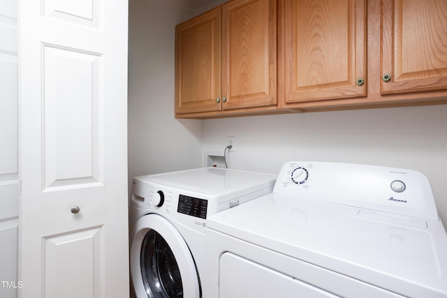 404 Denton St, Durham, NC 27713 - laundry room featuring cabinet space and separate washer and dryer
