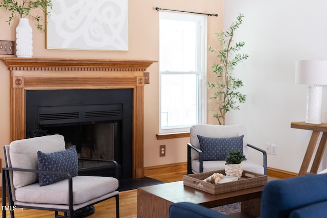 404 Denton St, Durham, NC 27713 - sitting room with wood finished floors and a fireplace with flush hearth