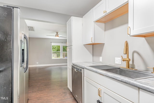 1401 Robinhood Rd, Durham, NC 27701 - kitchen featuring stainless steel appliances, dark wood-style floors, a ceiling fan, white cabinetry, and light countertops