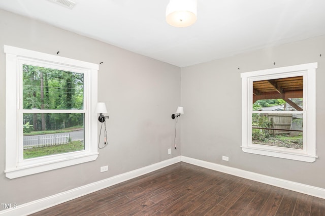 1401 Robinhood Rd, Durham, NC 27701 - unfurnished room featuring plenty of natural light and dark wood finished floors