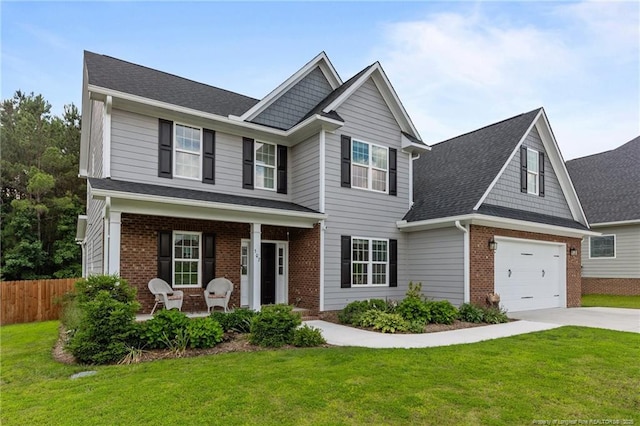 507 Coxwold Pl, Fayetteville, NC 28311 - view of front of home with covered porch, brick siding, driveway, and a shingled roof