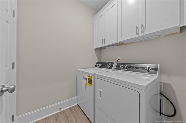 507 Coxwold Pl, Fayetteville, NC 28311 - washroom featuring cabinet space, washing machine and dryer, and light wood finished floors
