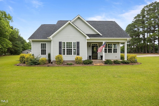 416 Fred Tew Rd, Dunn, NC 28334 - view of front of house with a front lawn, a shingled roof, and covered porch