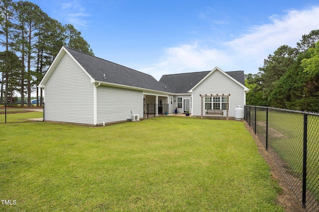 416 Fred Tew Rd, Dunn, NC 28334 - rear view of house with a fenced backyard and roof with shingles