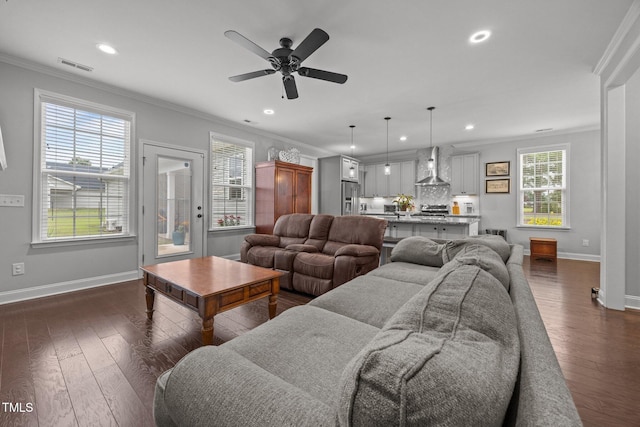 416 Fred Tew Rd, Dunn, NC 28334 - living area with dark wood finished floors, crown molding, recessed lighting, and ceiling fan