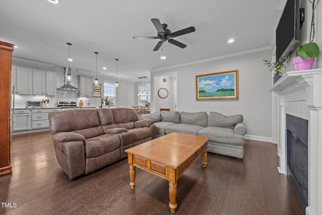 416 Fred Tew Rd, Dunn, NC 28334 - living area with dark wood-style flooring, recessed lighting, ceiling fan, crown molding, and a fireplace