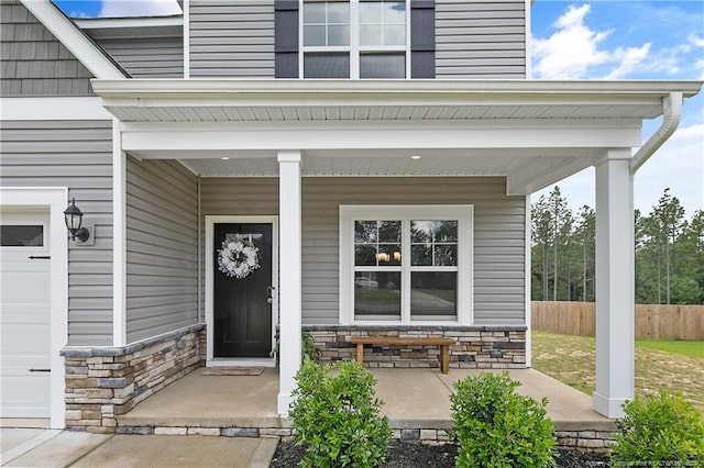 209 Nairn St, Fayetteville, NC 28311 - entrance to property with a porch, stone siding, and a garage