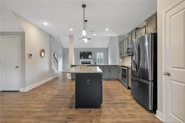 209 Nairn St, Fayetteville, NC 28311 - kitchen with appliances with stainless steel finishes, gray cabinetry, a ceiling fan, wood finished floors, and recessed lighting