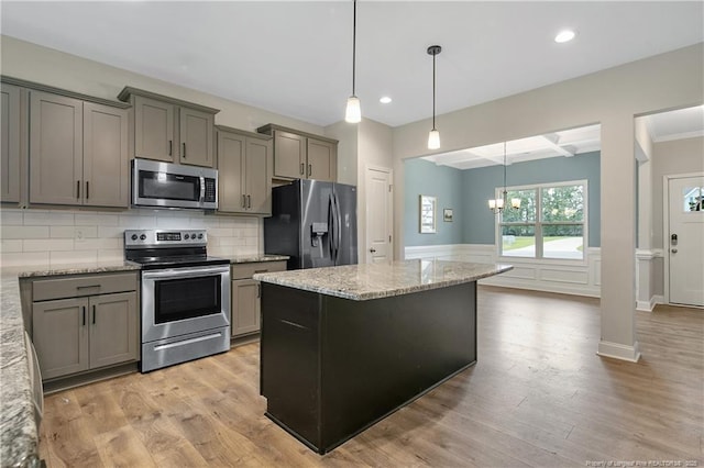 209 Nairn St, Fayetteville, NC 28311 - kitchen with stainless steel appliances, tasteful backsplash, light stone countertops, gray cabinets, and light wood-style floors
