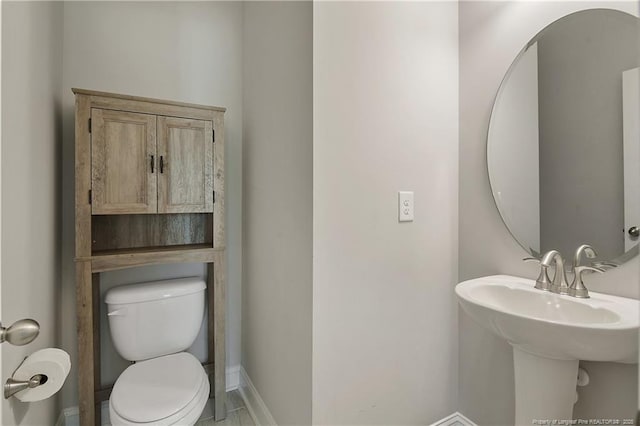 209 Nairn St, Fayetteville, NC 28311 - half bathroom featuring toilet and baseboards