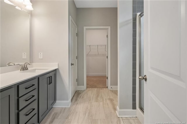 209 Nairn St, Fayetteville, NC 28311 - full bathroom featuring vanity, a spacious closet, and a shower with door