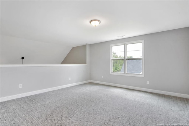 209 Nairn St, Fayetteville, NC 28311 - additional living space with carpet flooring and vaulted ceiling
