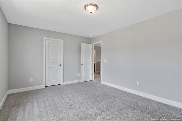 209 Nairn St, Fayetteville, NC 28311 - unfurnished bedroom featuring baseboards and carpet floors