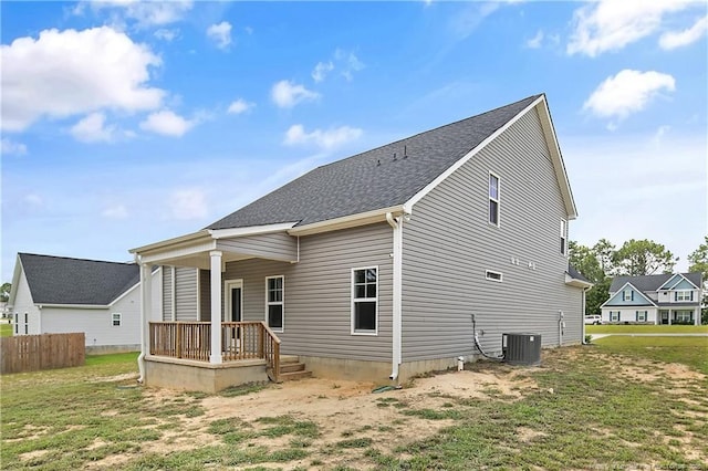 209 Nairn St, Fayetteville, NC 28311 - back of property featuring a porch, roof with shingles, and a yard
