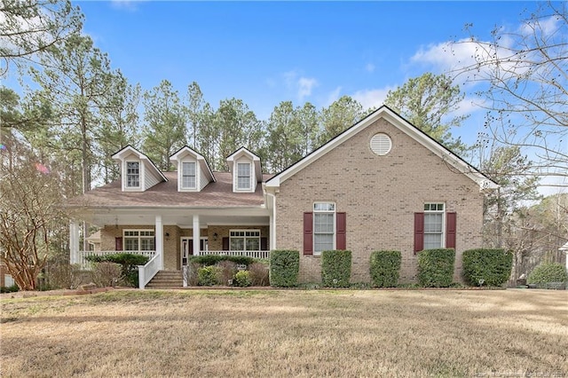 61 Fountain Park Cir, Spring Lake, NC 28390 - view of front of home featuring brick siding, a porch, and a front lawn