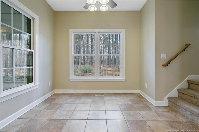 61 Fountain Park Cir, Spring Lake, NC 28390 - unfurnished dining area with ceiling fan, stairs, and tile patterned floors