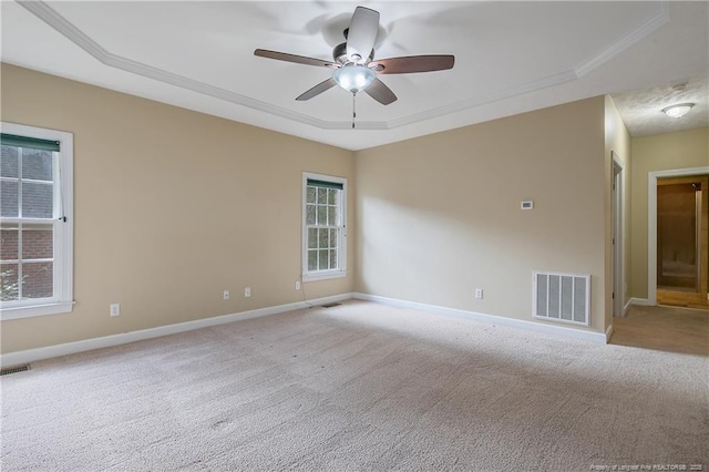 61 Fountain Park Cir, Spring Lake, NC 28390 - empty room featuring a tray ceiling, carpet flooring, ceiling fan, and crown molding