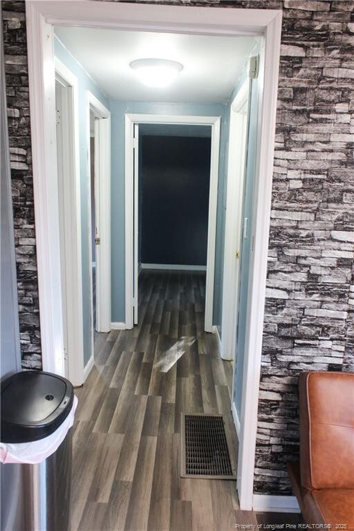 411 Rainey Dr, Spring Lake, NC 28390 - corridor with wood finished floors and baseboards