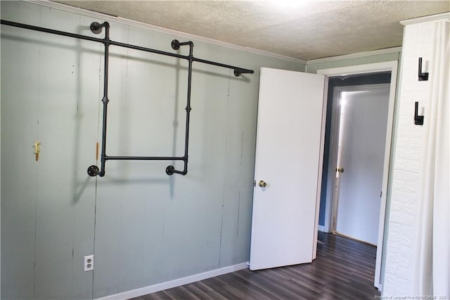 411 Rainey Dr, Spring Lake, NC 28390 - unfurnished bedroom with dark wood-style floors and a textured ceiling