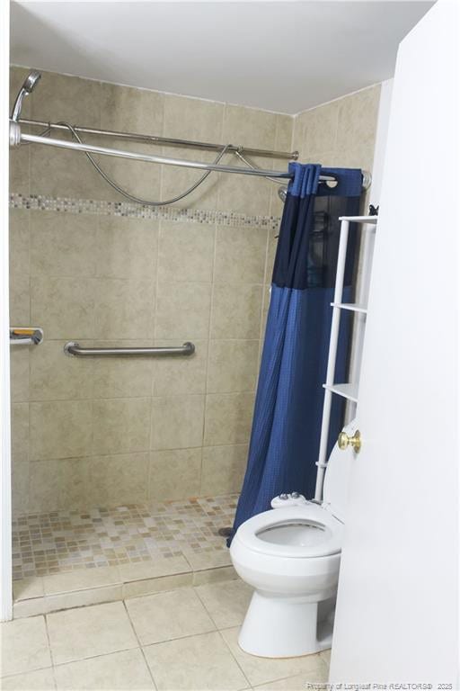 411 Rainey Dr, Spring Lake, NC 28390 - bathroom featuring a shower stall and tile patterned flooring