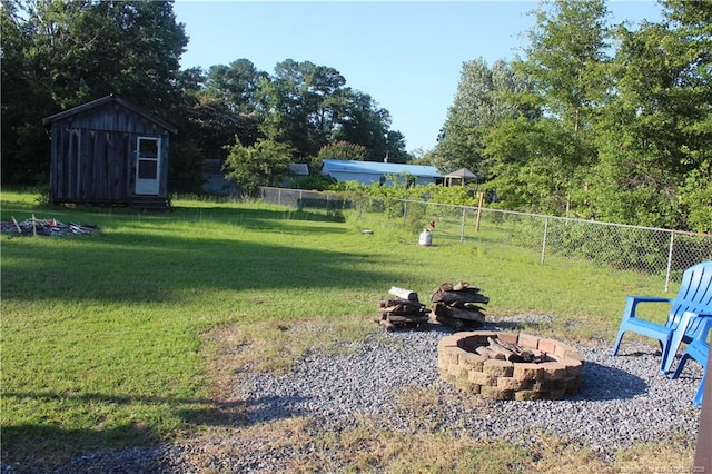 411 Rainey Dr, Spring Lake, NC 28390 - view of yard with an outdoor fire pit and an outbuilding