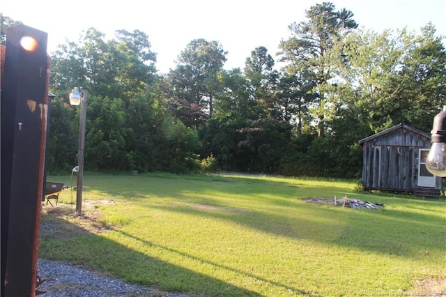 411 Rainey Dr, Spring Lake, NC 28390 - view of grassy yard featuring a shed