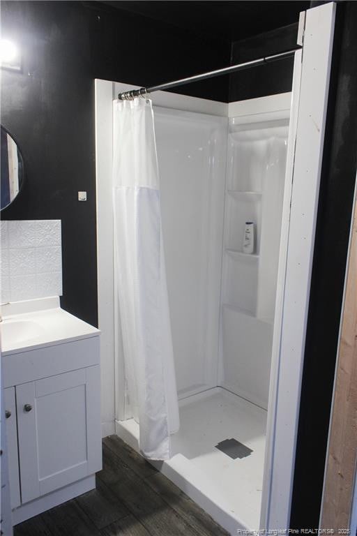 411 Rainey Dr, Spring Lake, NC 28390 - bathroom featuring vanity, wood finished floors, and a stall shower